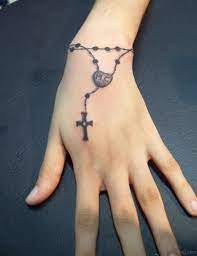 Maybe you would like to learn more about one of these? 30 Cool Rosary Tattoos On Hand