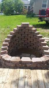 The only hard work involved is shoveling the dirt and unloading the retaining wall blocks. My Beautiful New Fire Pit My Husband And I Built Used Crestone Ii Retaining Wall Blocks In Autumn Blend 3 1 Backyard Fire Outside Fire Pits Fire Pit Patio