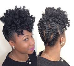 This braided updo features two boxer braids that are neatly styled into a bun at the bottom of the hair. 50 Updo Hairstyles For Black Women Ranging From Elegant To Eccentric