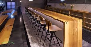 Live Edge Ash Bar Top With Waterfall Sides This Piece Was Handcrafted For Chicago Area Brewery Roaring Tables By S Live Edge Bar Wood Bar Top Wood Bar Table