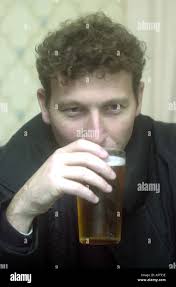 Cricket star Mike Atherton drinking a pint of beer Stock Photo