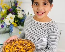 Young baker reaches for her dreams