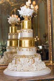 Magnificent Luxurious Hand Crafted Multi Tiered Wedding Cake In Ivory And Gold Complemented With Unique Wedding Cakes Luxury Wedding Cake Floral Wedding Cakes