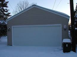 Dual red doors conceal the creative lounge area and project space contained in this converted garage. 9 Free Diy Garage Plans