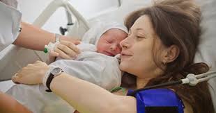 Image result for photo of mother giving birth