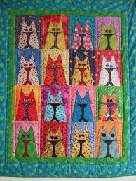 Use applique quilt patterns to create a decorative flourish on your lap quilts, wall hanging quilts, and more. Clever Cats In Arts And Crafts Cat Quilt Cat Quilt Patterns Quilts