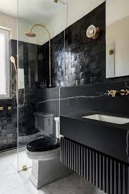 This small space bathroom features many small space tricks, including the perfect combination of mirror and glass. Bathroom Glass Partition Design Ideas