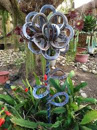 A Refreshing Change From The Run Of The Mill Cows And Dragons Of Metal Art Metal Garden Art Metal Tree Wall Art Horseshoe Crafts