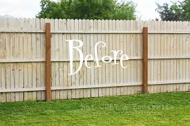 White picket and natural wood fences may be more common, but garden fences painted black can be surprisingly effective in the landscape. Planter Boxes On The Fence Stacy Risenmay