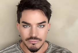 ADAM LAMBERT Says Years Of Touring With QUEEN 'Really Did Put Some Coins In The Bank'