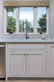 The kitchen is at the center of the main living spaces where we designed multiple islands for smart base cabinet storage which still allows visual connection from the kitchen to all spaces. Cabdoor Custom Painted To Colour Match London Fog By Benjamin Moore Mobile Home Decorating Custom Kitchen Cabinets Kitchen Cabinet Doors