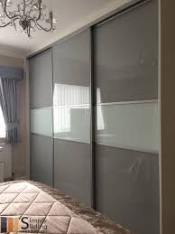 One Of Our Multi Panel Grey Glass Sliding Door Wardrobes Wardrobe Door Designs Sliding Door Wardrobe Designs Wardrobe Design Bedroom