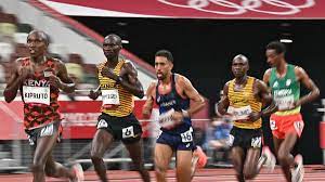 A fatiguing marathon runner in the leading pack raised eyebrows at the tokyo olympics on sunday when he knocked over an entire row of drinks and ran off with the last bottle. M1uzw3gheqrolm