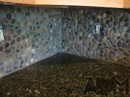 Pebble tile glass is made of highly polished river rocks attached to a mesh bottom with interlocking sides. River Pebble Tile Kitchen Backsplash A Diy Project Anyone Can Do