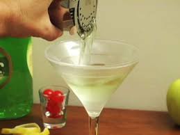 Shake with ice and strain into a cocktail glass. How To Make An Appletini Howcast