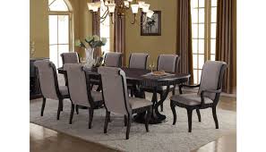 The dimensions of your dining room table should reflect the spacing of the room, not just the size of your family. Lusaka Formal Dining Room Table Set