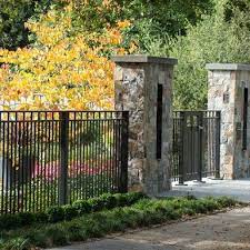 Available at very reasonable rate, presented metal front yard fence is highly demanded in the market. Stone Gate Pillars Black Metal Fence Fun Stuff Pinterest Modern Fence Fence Design Front Yard Fence