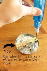 If you are mounting your sconce on the wall and allowing the cord to hang down the wall, you just need to because i was attaching my light to really thin beadboard, i reinforced the screws into a small block. How To Turn A Hard Wired Light Fixture Into A Plug In The Happy Housie