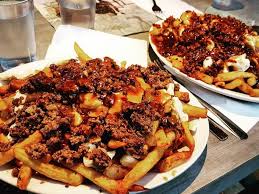 Poutine served in a box. Best Poutines In Quebec City Visit Quebec City