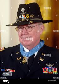 Retired Army Lt. Col. Bruce Crandall stands after receiving the Medal of  Honor, during a ceremony in the East Room of the White House, in Washington 