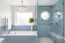 Master Bath Design With Soft Blue Glass Subway Tile Carrara Marble And Glamorous Light Fixture Blue Bathroom Tile Bathroom Design Decor Bathroom Decor Colors