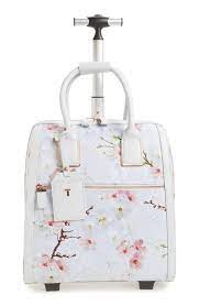 7 Cute Luggage Pieces To Travel With Ted Baker Alayaa Cherry Blossom Two Wheel Travel Bag From Instyle Com Cute Luggage Cute Suitcases Stylish Bag
