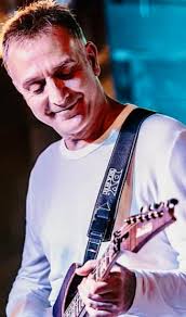 Tantrum to Blind • Corrado Rustici -guitar [2nd solo] • Allan Holdsworth  -guitar [1st solo] • Peter Vettese -keyboards • Michael Manring -bass •  Steve Smith -drums.