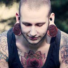 Stretching The Limits Tattoo Artists Near Me Lip Tattoos Tiki Faces