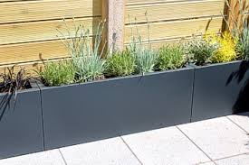 This black veradek geo trough planter makes for an easy decoration for various parts of your home. Large Trough Planters