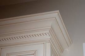 I have maple shaker style upper cabinets in my kitchen that stop about 6″ from my ceiling. The Art Of Molding