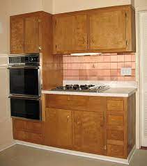 Appliances are neutral colors (no harvest yellow or avocado). Wood Kitchen Cabinets In The 1950s And 1960s Unitized Vs Modular Construction Kitchen Remodel Layout Interior Design Kitchen Kitchen Design