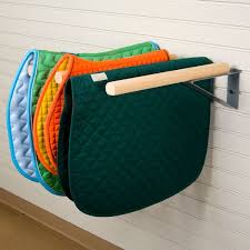 I had seen some pvc saddle pad racks on pinterest, but they were all straight perpendicular from the wall style and i needed the rack to swivel from perpendicular to parallel. Pin On Horse Stuff