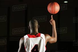 What is the longest time for spinning a ball on your finger? Basketball Player Spinning Basketball Atop Finger Rear View Stock Photo Dissolve