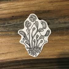 There is a venus flytrap inked on andre's body. Venus Flytrap Temporary Tattoo Nature Tattoos Plant Tattoo Black Ink Tattoos