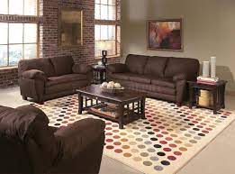 Add a bergere chair upholstered in animal prints liven up a room with brown leather furniture. Pin By Melissa Arps On Home Living Room Color Schemes Brown Living Room Living Room Colors