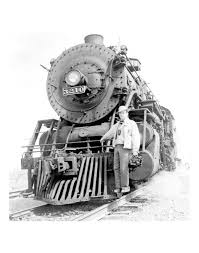 Jack Delano, Farm Security Administration/Office of War Information  photographer, full-length portrait, holding camera, standing