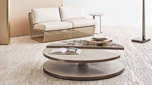 Flat on one side and rounded on the other, half moon tables sit flush against walls and furniture. Rugiano