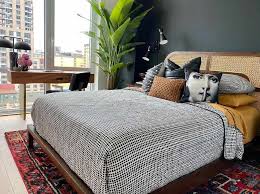 Stunning gray bedroom with gray walls framing dark gray tufted headboard and kravet. 23 Ways To Decorate With Charcoal Gray For Modern Style