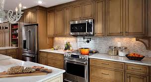 Kitchen Remodel In A Maple Coriander Cabinet Finish With A Coffee Glaze From Decora Cabinets Against Wh Countertops Kitchen Countertops Inexpensive Countertops