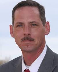 A Kennesaw State police officer is fighting for his life after his  Cartersville home burned down