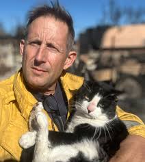 Sharing this story from our friends at CAL FIRE. On the #PalisadesFire, Cal  Fire's Michael Deleo and Mutnomah County Strike Team 12 rescued a  black-and-white cat, now named "Domino". The feline was