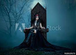 dark evil queen sitting on a luxurious throne dark boho cosplay to the film snow white and the huntsman wild princess in 2021 dark queen queen photoshoot dark evil
