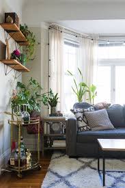 A Cozy Plant Filled Bohemian Apartment Boho Living Room Boho Living Room Decor Cozy Apartment Decor