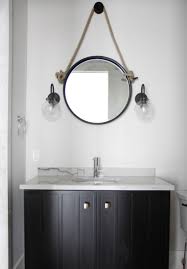 The sconce is used for several purposes, it can be used to hold a torch light or even a candle, but in the bathroom, it usually holds an electric bulb or an energy saver. Wall Sconce Roundup Park And Oak Interior Design
