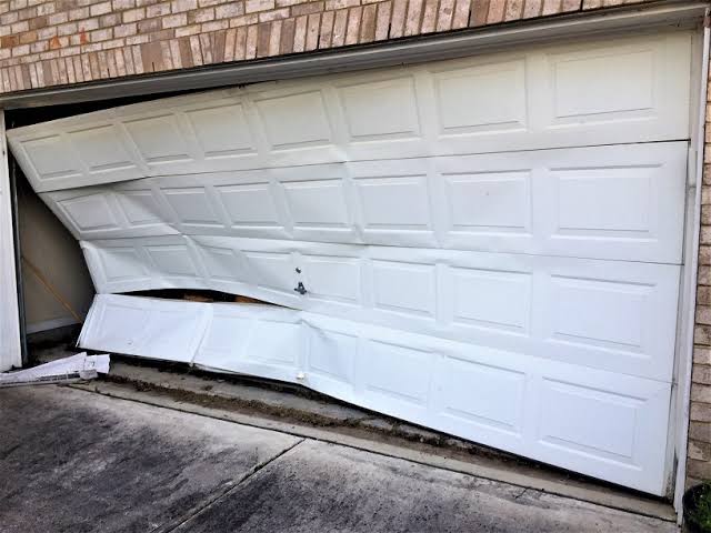 LiftCrest technician inspecting a garage door spring system on a Las Vegas home
