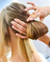 A low, loose bun for long hair is a great option for disguising your hair elastic. How To Do A Chignon Bun Easy Chignon Hair Tutorial