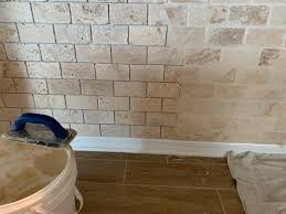 Bridge recommends a porcelain tile that looks like travertine. Ceramictec On Twitter Grouting The 2x4 Crema Antiqua Tumbled Travertine Backsplash And Island Front On The Riverview Florida Project Tile Backsplash Tumbled Travertine Riverview Ceramictec Https T Co Hzqvabu7xe