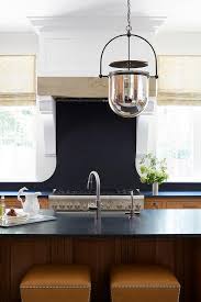 maple kitchen cabinets with black