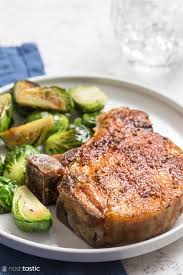 The thick, succulent chops stuffed with a savory bacon and parmesan dressing are baked with wine. Easy Air Fryer Pork Chops Keto Paleo W30 Noshtastic