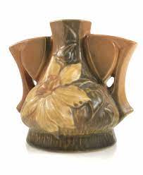 A large chip repair on the lip & some crazing of the glaze with light marks from decades of display and storage but otherwise lovely. Lot Roseville Pottery 50 Clematis Pattern Flower Frog